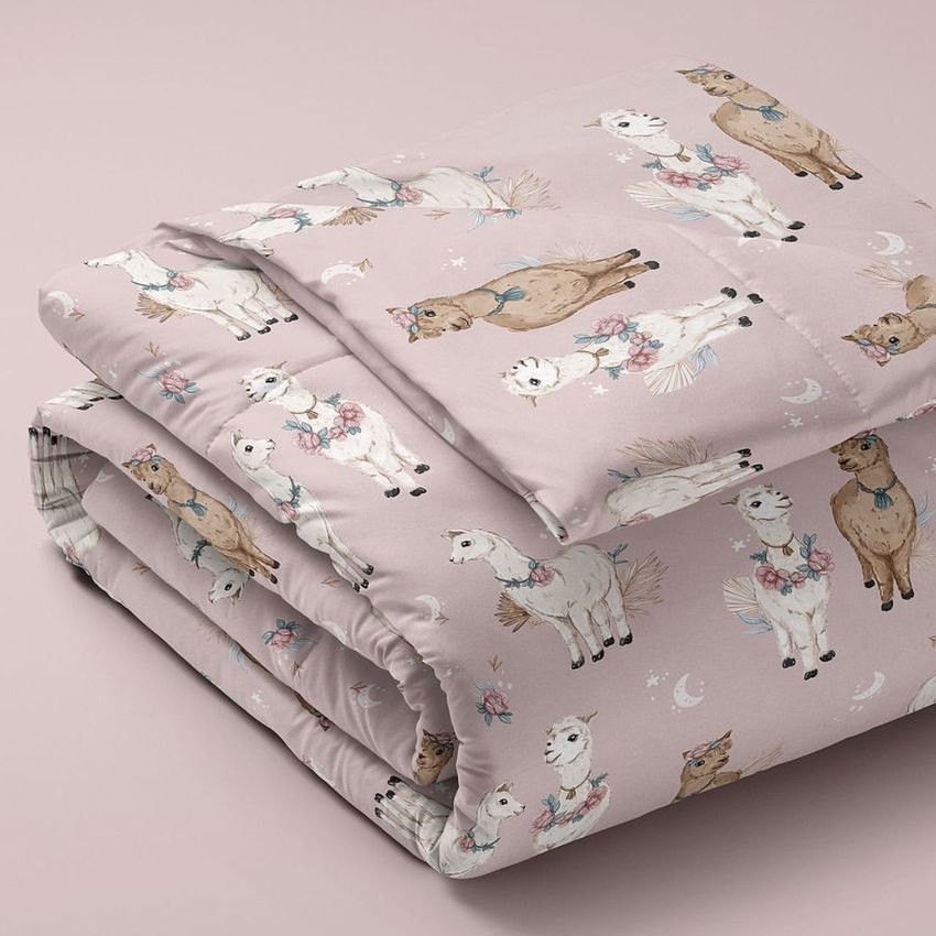 Microfiber comforter mockup featuring a folded blanket with a pastel pink background and whimsical alpaca illustrations.