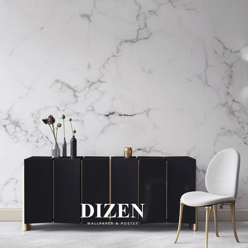 Canvas print mockup showing a black sideboard with gold accents, a white chair, and a marble-patterned wall background.