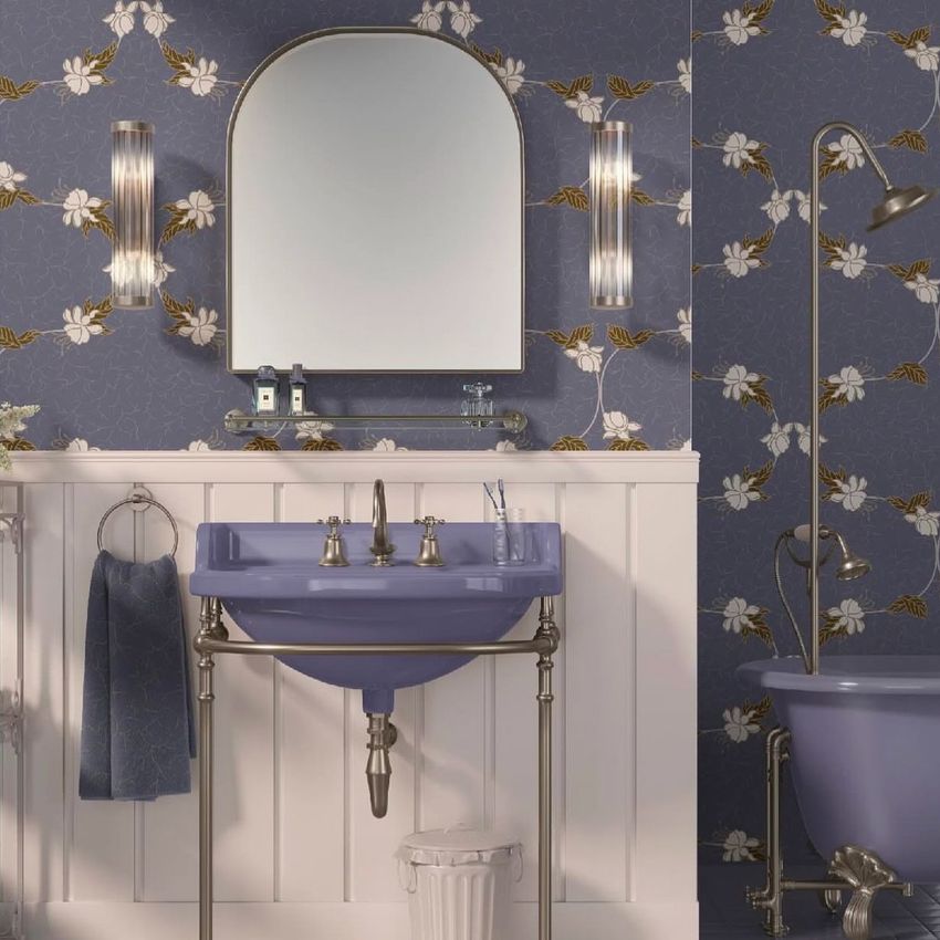 Traditional style bathroom mockup featuring a fuchsia sink and bathtub, floral wallpaper, and a large arched mirror above the sink.