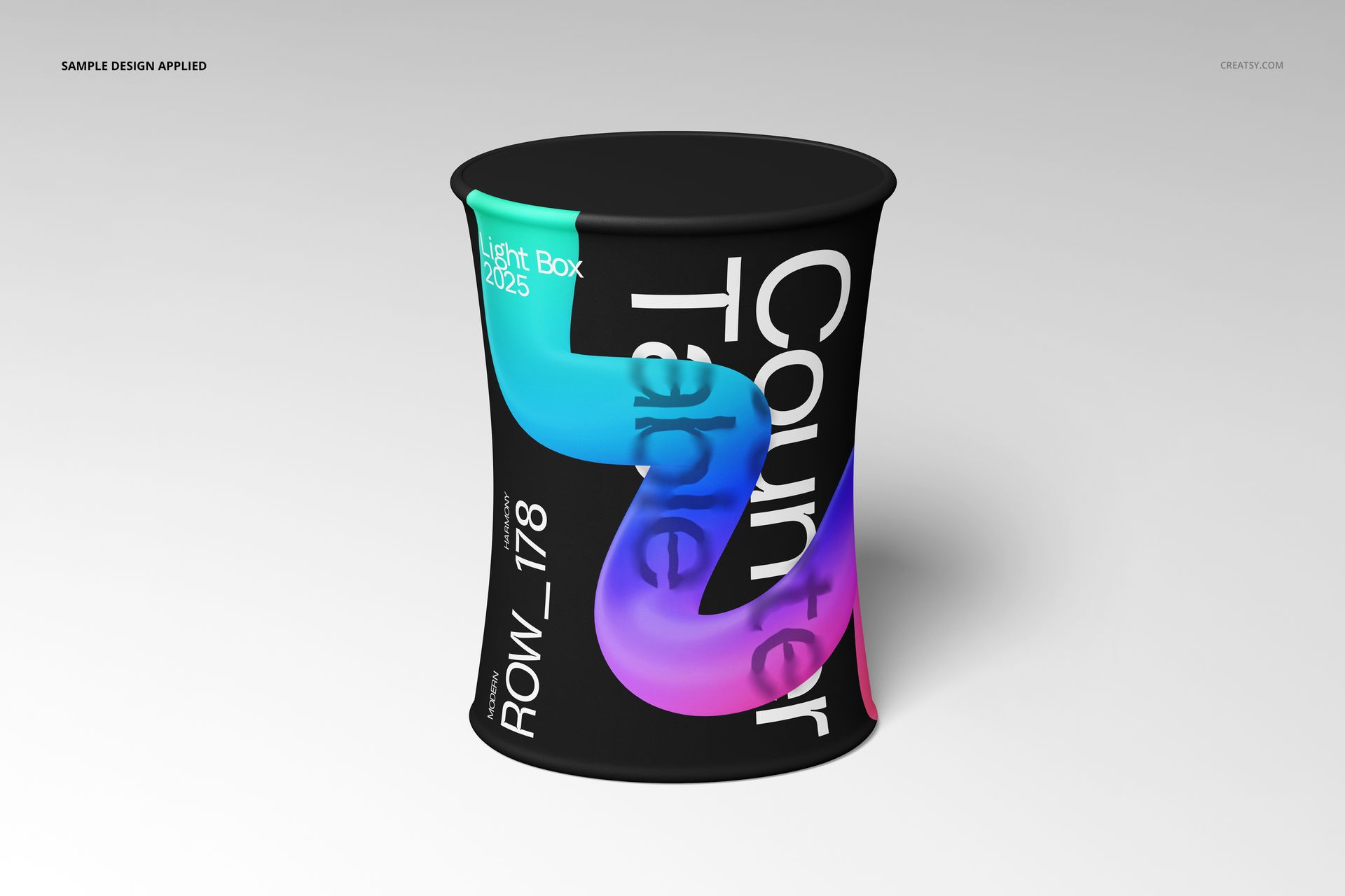 Elliptical pop-up counter mockup featuring a black background and vibrant curved patterns, shown in a studio setting.