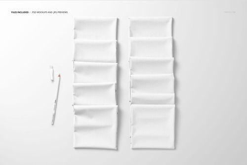 Folded Fabrics Mockup PSD showing multiple white textile squares in neat rows, viewed from above on a pale background.