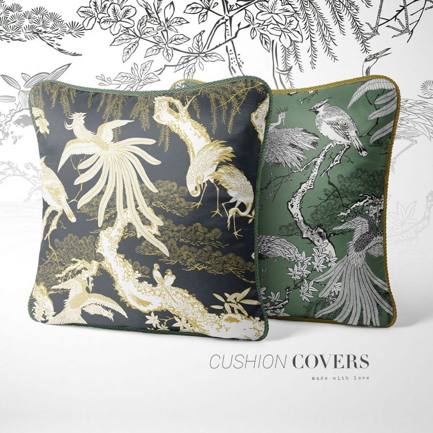 Silk cushion mockup featuring two square pillows with elegant gold and white bird patterns on dark green and black backgrounds.
