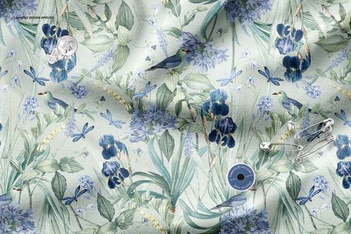 Top view of a wrinkled textile mockup with detailed floral and bird motifs on a light background.