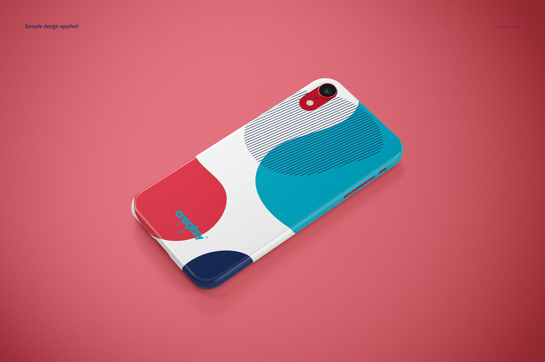 Glossy iPhone XR snap case mockup with abstract blue, red, and white pattern, shown in angled top view on pink background.