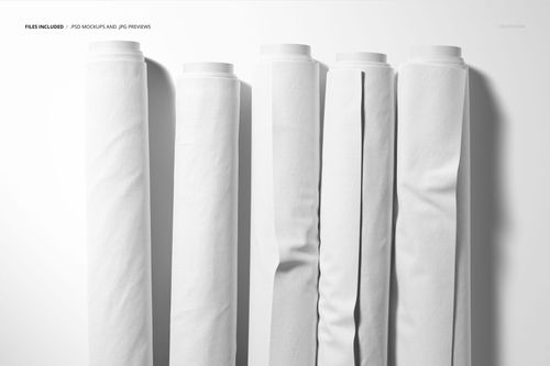 Front view of five white fabric rolls standing vertically on a light surface, showing smooth and textured materials.