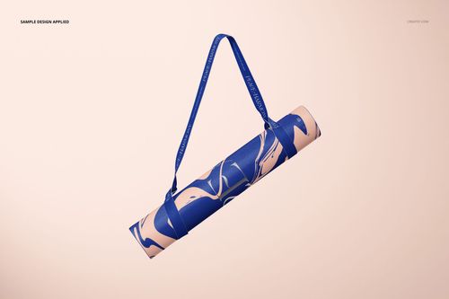 Yoga mat mockup featuring a rolled mat with swirling blue design and blue strap, set against a neutral backdrop.