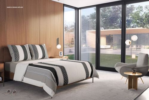 PSD mockup of a sunlit bedroom with a neatly made bed, gray and white duvet, pillows, and outdoor garden view.