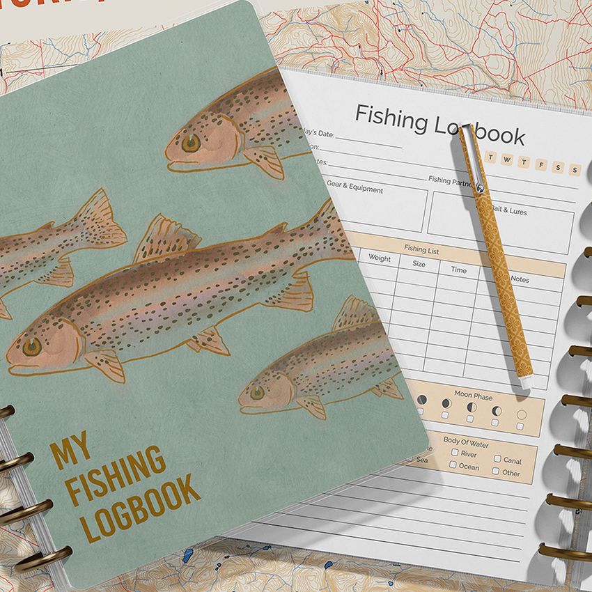 Flat lay of spiral-bound planner mockup, featuring a cover with fish illustrations and an open page with a pencil on a form layout.