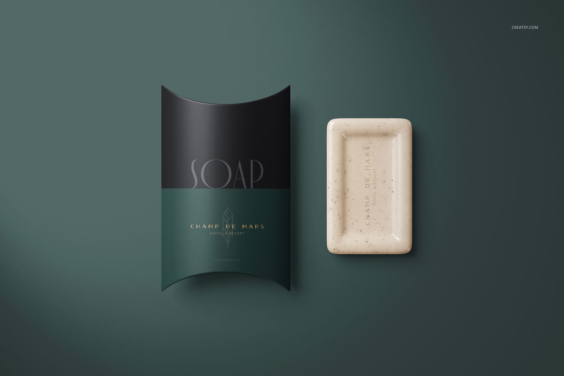 Rectangular hotel hand soap next to a curved pillow box mockup, both in green and black tones, top view.