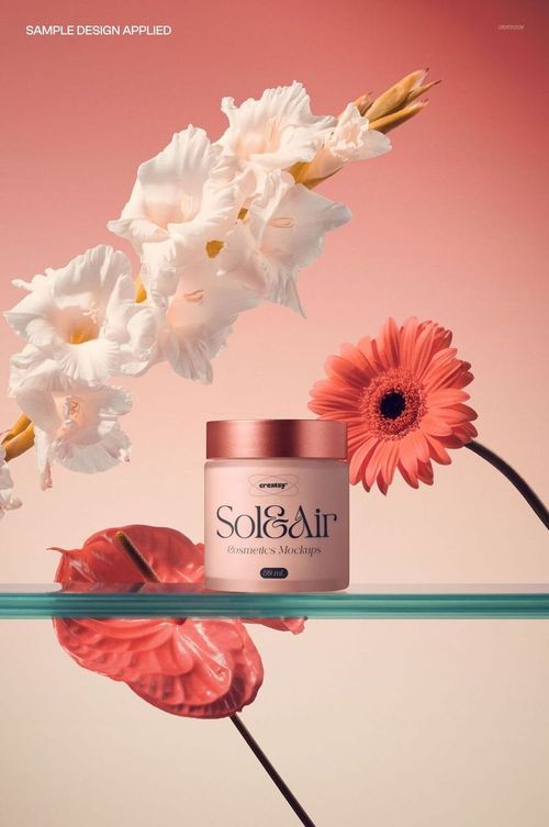 Front view of a cosmetic jar mockup on a transparent shelf, with gladiolus and gerbera flowers in a pink-toned setting.