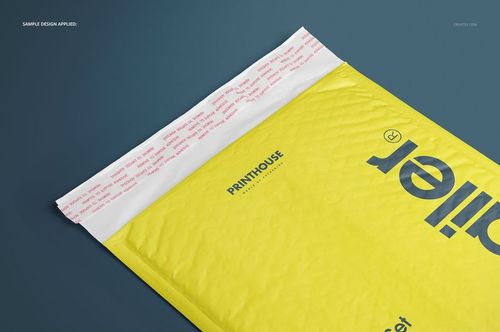 Yellow bubble mailer envelope mockup with printed text, shown from a top angle on a dark blue surface.