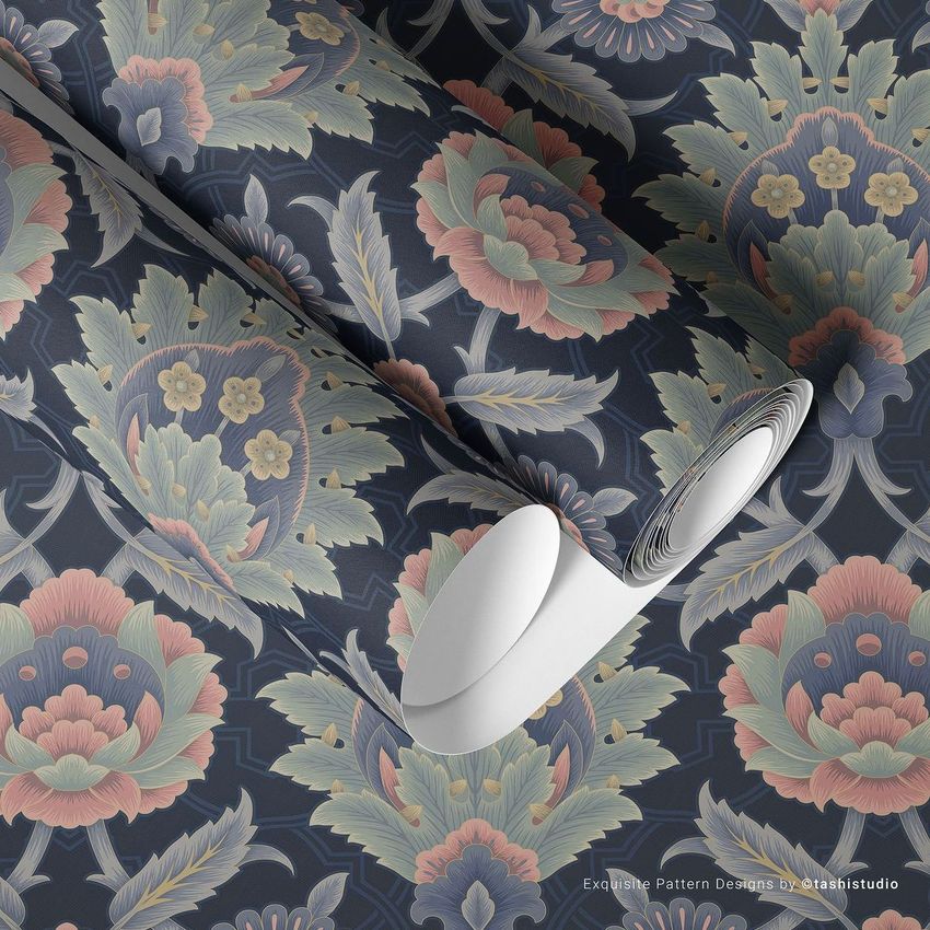 Paper wallpaper mockup showing two rolled sheets with a floral pattern in muted blue, pink, and green tones on a flat surface.