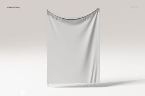 Fringed tapestry blanket displayed hanging, shown from the front with soft white fabric and subtle shadowing.