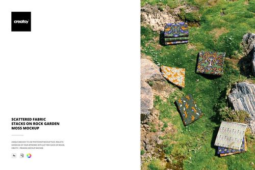PSD mockup showing multiple fabric pieces with various prints placed on vibrant moss and stone background outdoors.