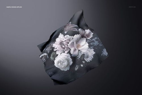Square fabric mockup featuring a delicate flower design, floating against a smooth, dark gray backdrop.
