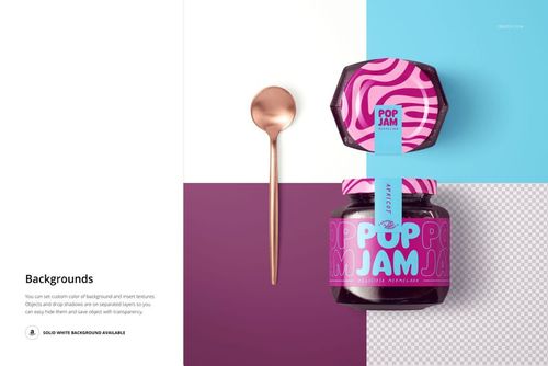 PSD mockup showing a blackcurrant jam jar with a bold pink and purple design, placed beside a metallic spoon on a divided backdrop.