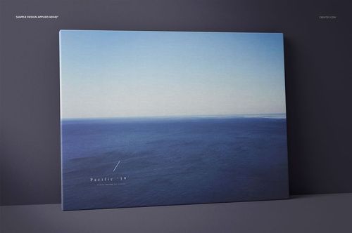 Front view of a thick canvas print mockup featuring a blue ocean artwork, standing against a neutral wall background.