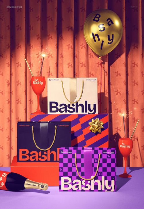 PSD mockup of colorful party gift bags with rope handles, ribbon ties, and festive props in a celebratory setting.