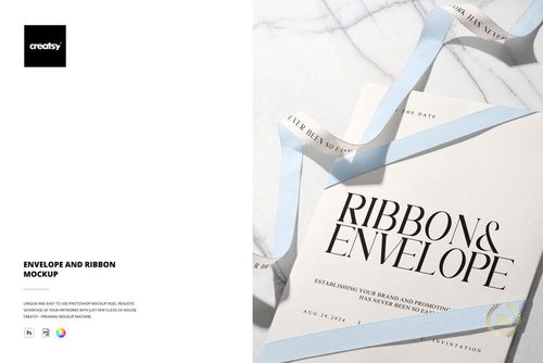 Top view of a stationery mockup featuring a cream envelope and invitation card with a light blue ribbon on marble surface.