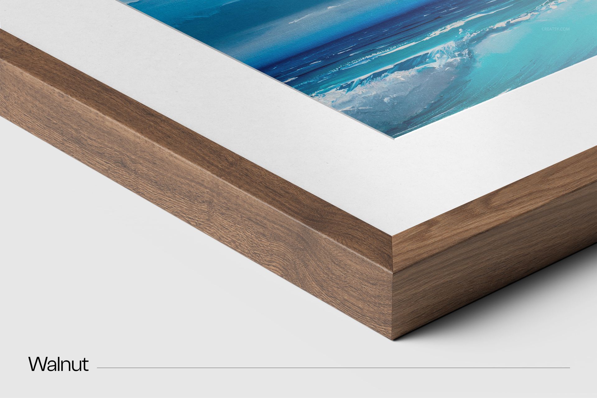 Closeup view of a solid wooden frame mockup with walnut finish, featuring a blue ocean print and white matting.