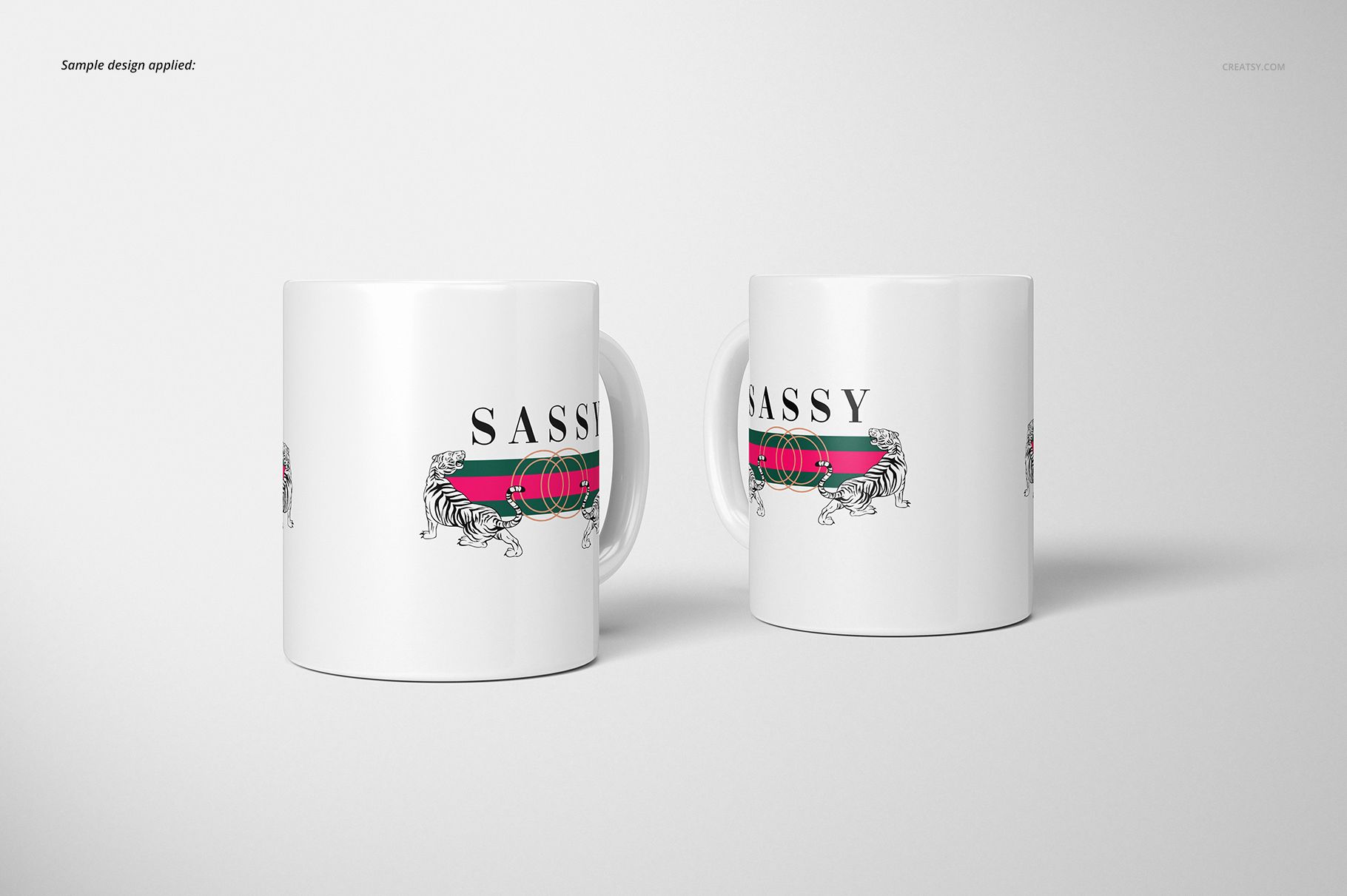 Two white 11oz mugs with a horizontal striped design and lion illustration, shown side by side on a plain background.