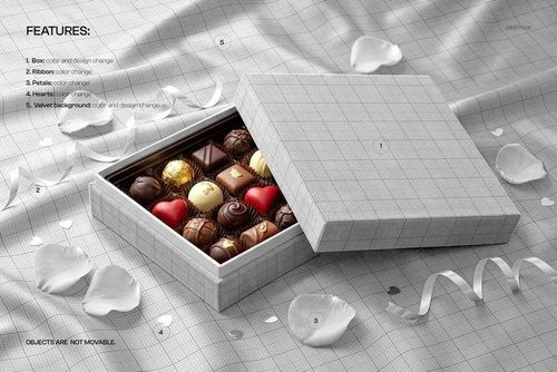 PSD mockup of a praline box on soft velvet fabric, lid partially open to reveal colorful chocolates inside.