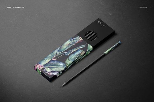 Pencil box mockup featuring a black cover with circular cutout and colorful leaf design, shown with a coordinating pencil.