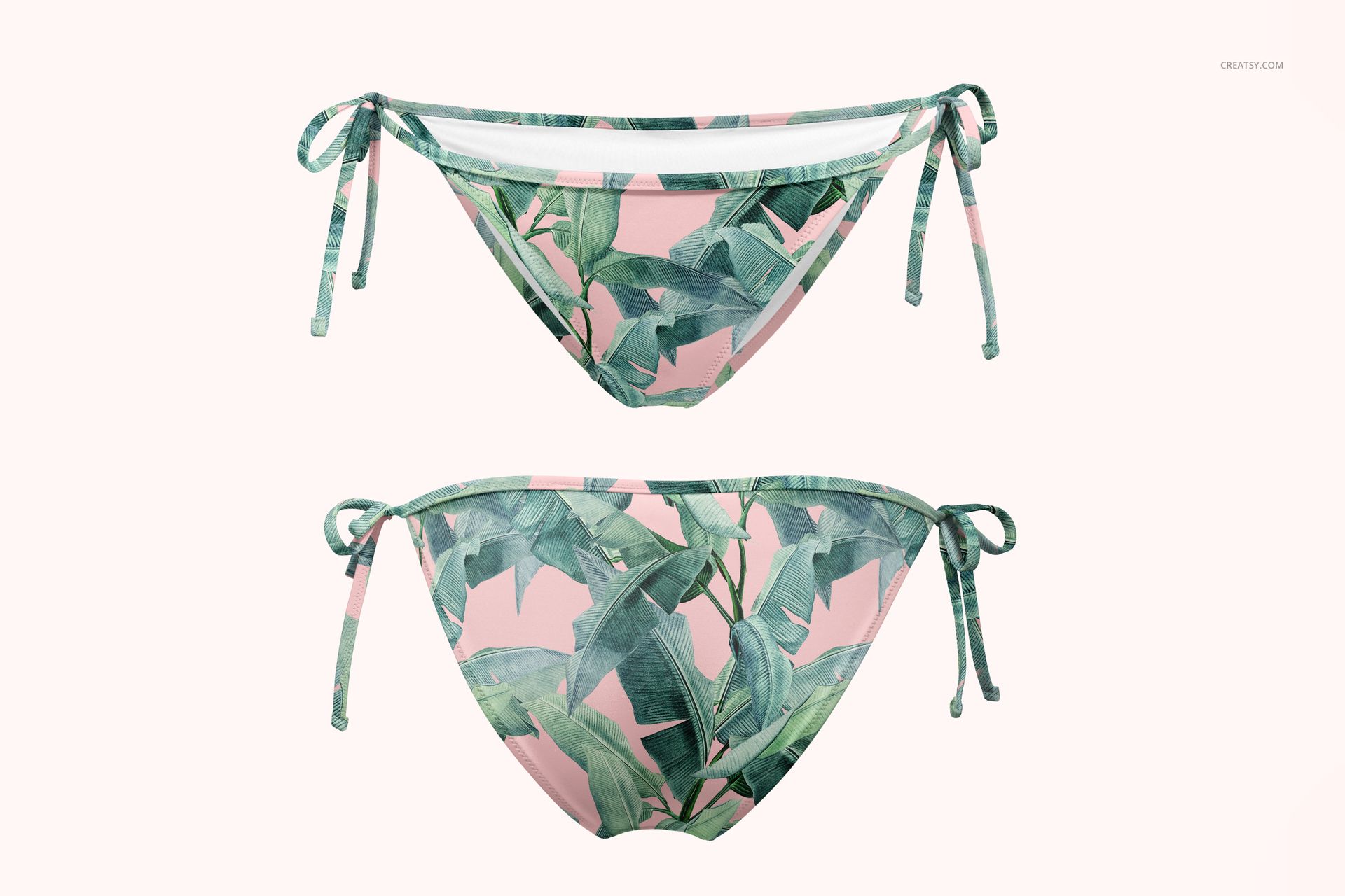 Front view of triangle bikini bottom mockup with green tropical leaf pattern on a soft pink background, isolated.