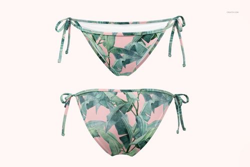 Front view of triangle bikini bottom mockup with green tropical leaf pattern on a soft pink background, isolated.