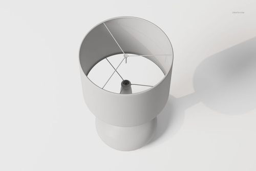 Minimalist bedside table lamp in matte white, viewed from above showing circular shade and central bulb holder.