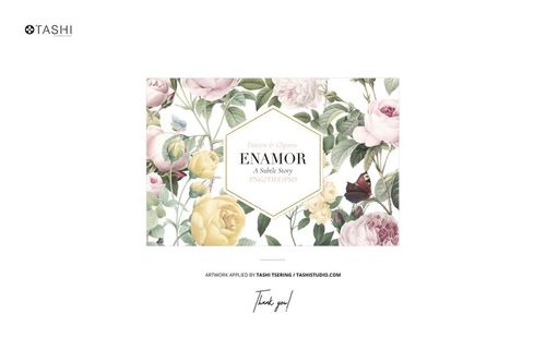 Floral pattern featuring pink and yellow roses with green leaves displayed on a white background in a decorative frame.