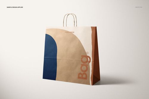 Kraft shopping paper bag mockup with curved color patterns in beige, blue, and brown, shown on a neutral surface.