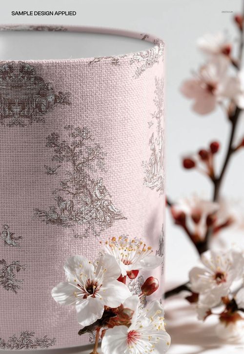 Drum lampshade mockup featuring detailed cherry blossom prints on soft pink fabric, shown with real blossoms in foreground.