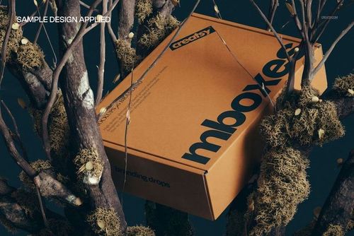 Brown kraft packaging box mockup displayed on moss-covered branches, featuring bold black lettering and side details.