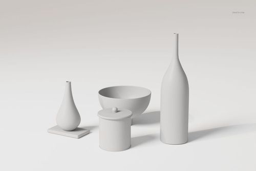 Front view of a modern ceramic vase set featuring four matte white objects, including bottles, bowl, and jar, on a light surface.