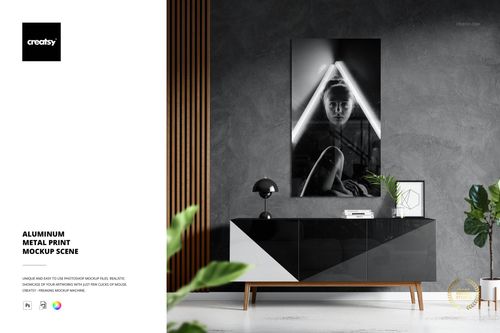Modern living room scene featuring a glossy aluminum metal print mockup with geometric black and white artwork on the wall.