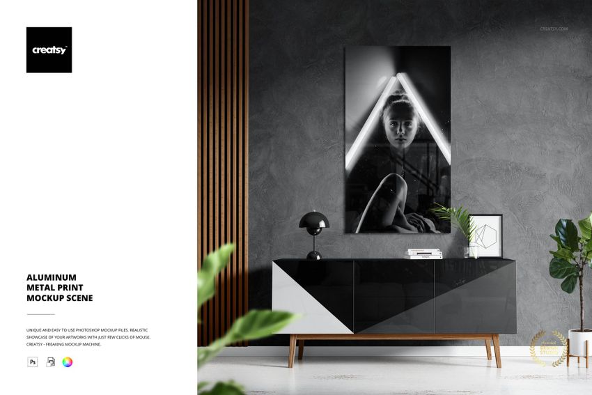 Modern living room scene featuring a glossy aluminum metal print mockup with geometric black and white artwork on the wall.