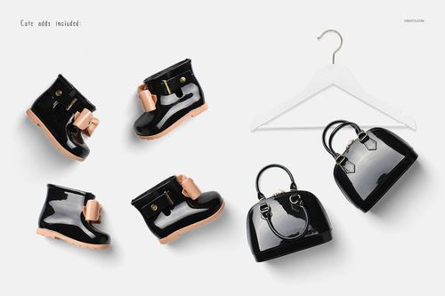 PSD mockup featuring black baby boots with pink accents, a black purse, and a white hanger displayed from above.