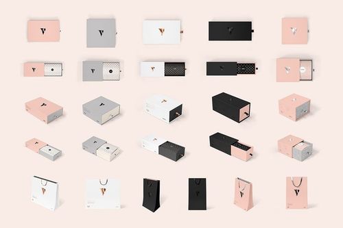 Front view of multiple packaging mockups, including rectangular boxes and shopping bags in soft pink, black, and white tones.