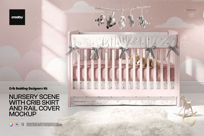 Front view of a pink crib with a white crib skirt and rail cover decorated with small hearts in a nursery mockup.