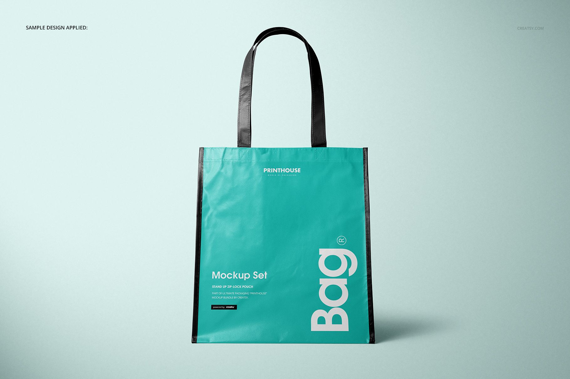 Front view of a laminated non-woven tote bag mockup with black handles and turquoise body, displayed on a light background.