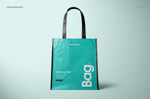 Front view of a laminated non-woven tote bag mockup with black handles and turquoise body, displayed on a light background.