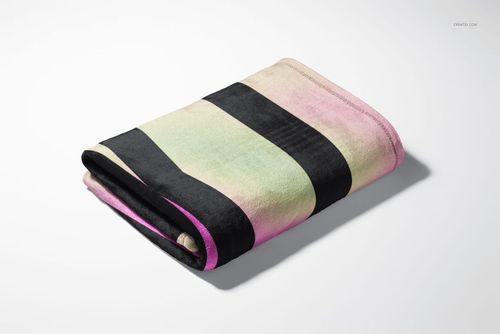 Fleece blanket mockup showing a folded blanket with black stripes and soft green, pink, and yellow gradients.