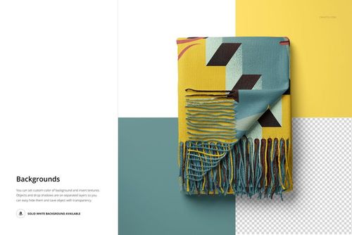 Folded blanket mockup featuring tassel fringe and bold geometric design in teal, yellow, and black on a split background.