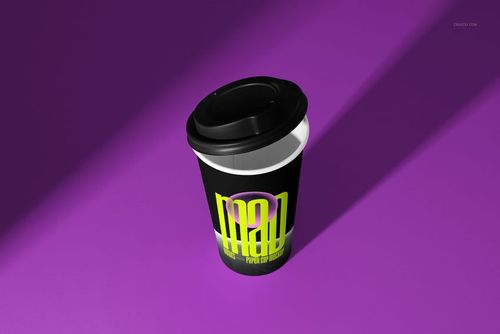 PSD mockup of a paper cup featuring a black lid and modern yellow lettering, placed on a solid purple surface.