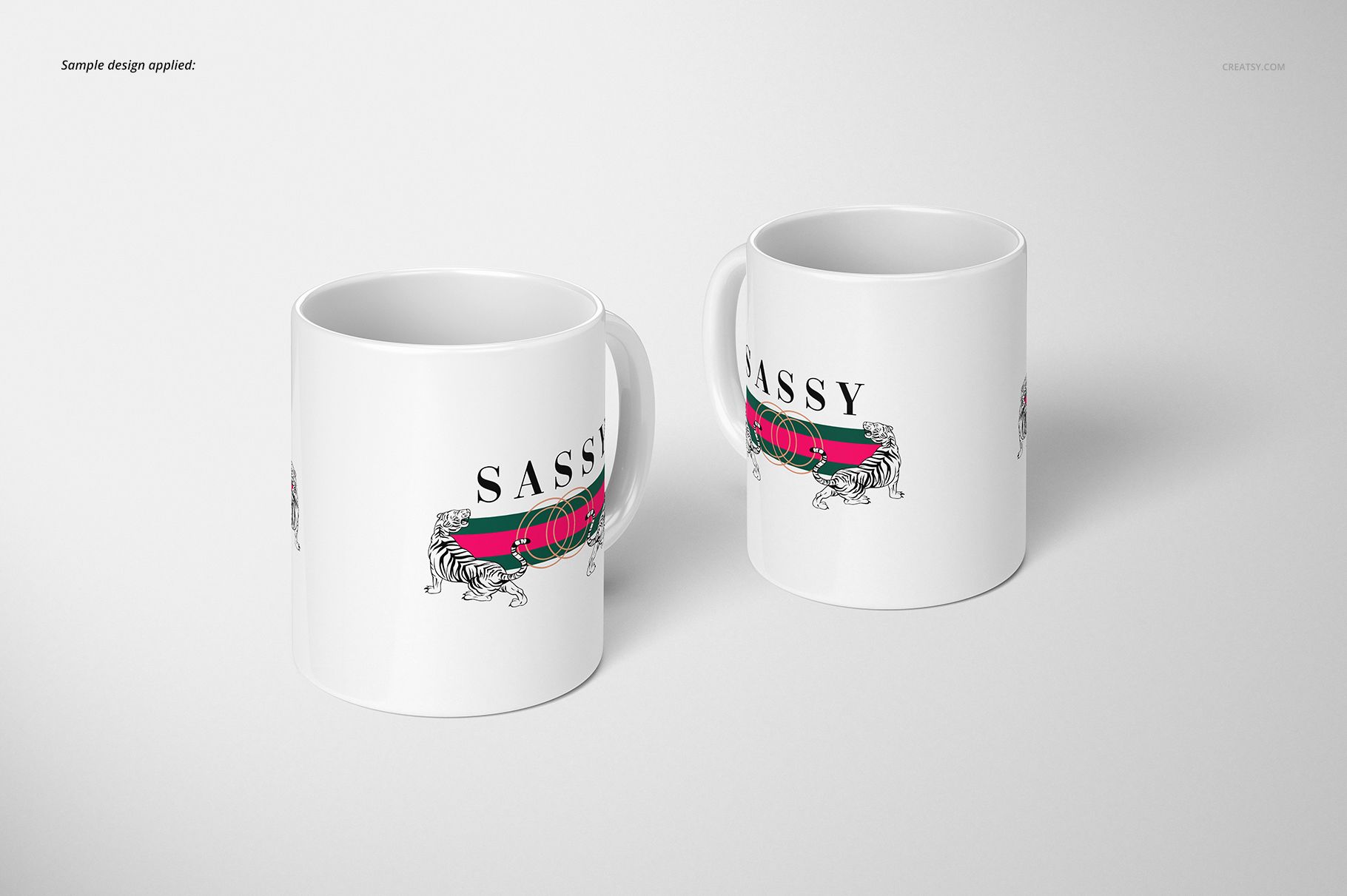 Two white 11oz mugs with a sassy text and tiger illustration, shown from a front angle on a plain light surface.