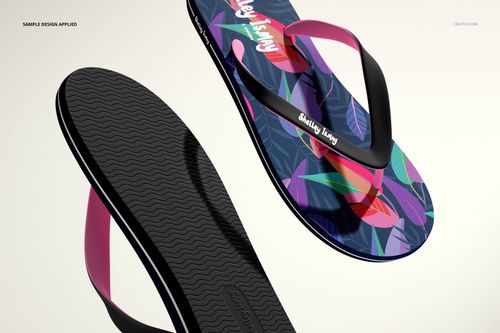 PSD mockup of flip flops with dark soles and vibrant leaf design, displayed on a light background from a side angle.