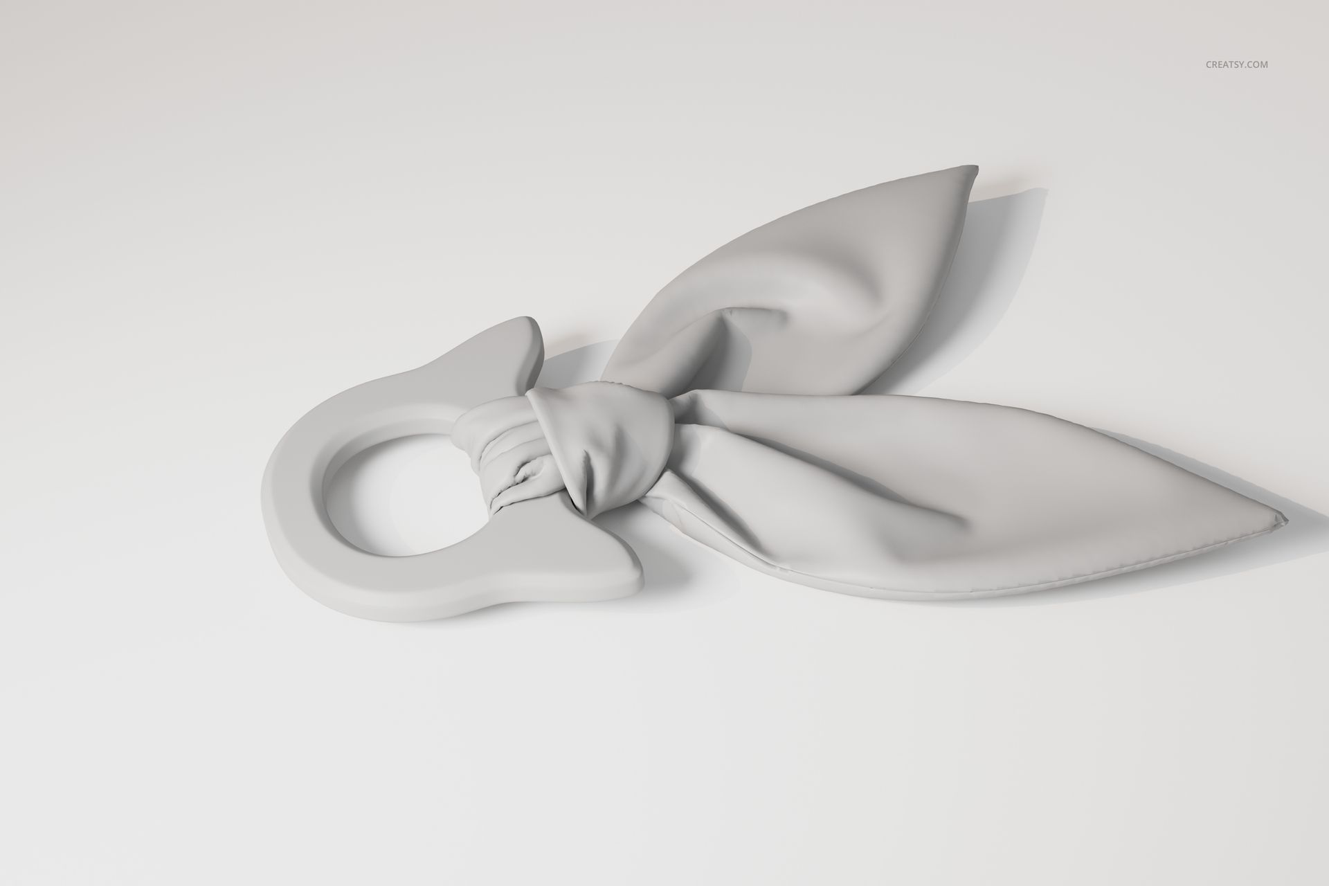 Wooden teether toy with a circular ring and two soft, fabric-like leaves, shown in a light gray color on a white surface.