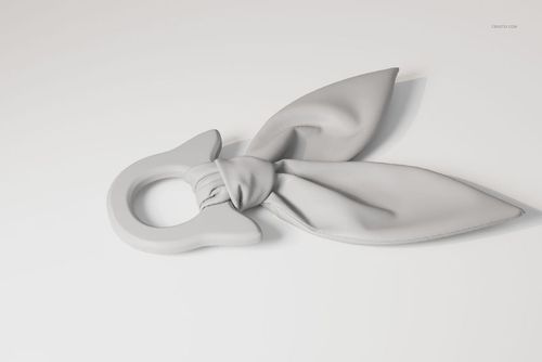 Wooden teether toy with a circular ring and two soft, fabric-like leaves, shown in a light gray color on a white surface.