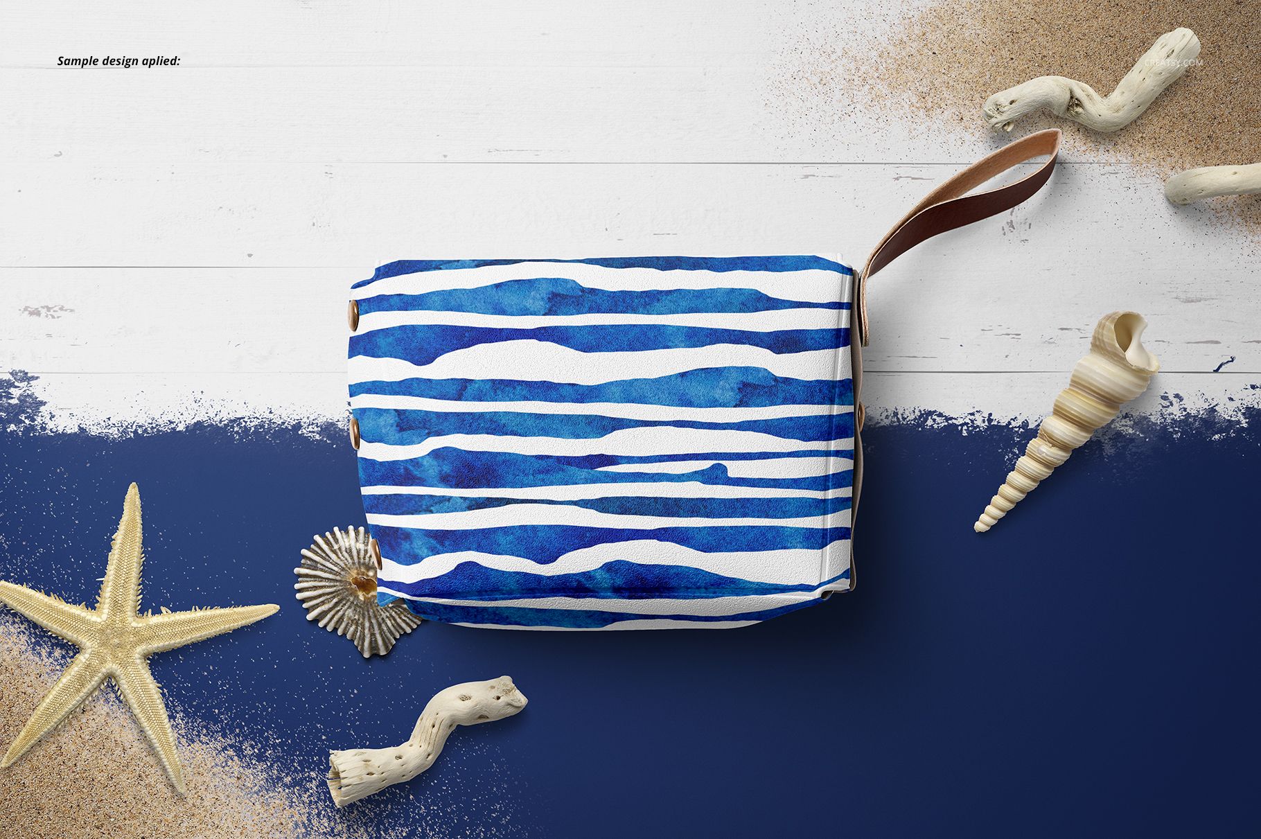 Little leather pouch wallet mockup displayed from above, featuring blue striped pattern and surrounded by seashells.
